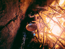 steel coffee mug on a campfire 