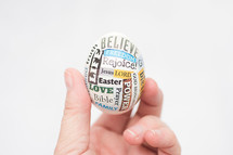 hand holding up an Easter egg