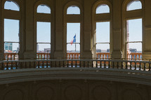 view of the Texas flag from the capitol building in Austin, Texas