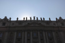 statues on a roof in the vatican 