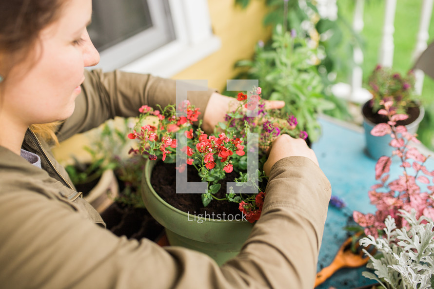 planting flower pots on a porch 