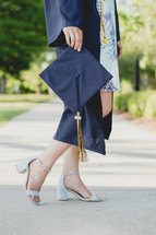 female graduate in heels 