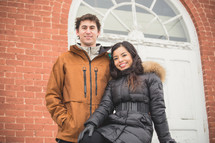portrait of a couple in winter coats 