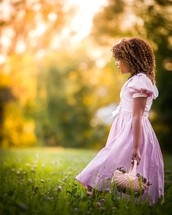 a little girl picking flowers 