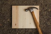 hammer on a wood board 