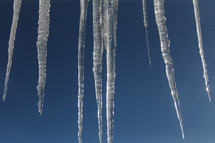 icicles against a blue sky 
