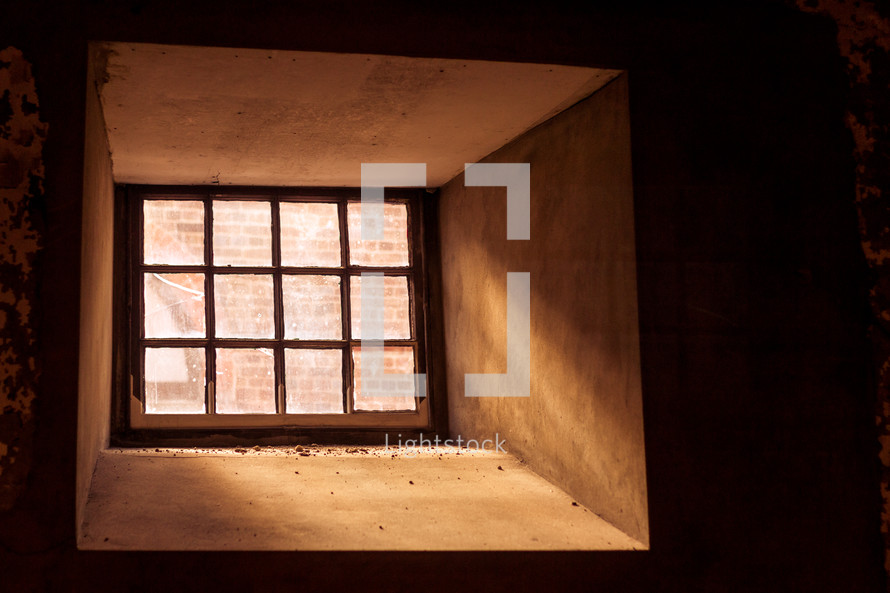 sunlight shinning into a cellar window 