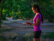 Portrait of young pretty sporty athletic woman  on summer park nature background. Lady before run workout.