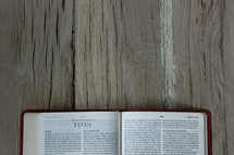 a Bible opened to Titus 