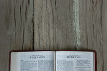 Bible opened to Philemon and Hebrews 