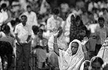 Woman in worship at worship service