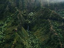 green rugged cliffs on a mountainous island landscape 