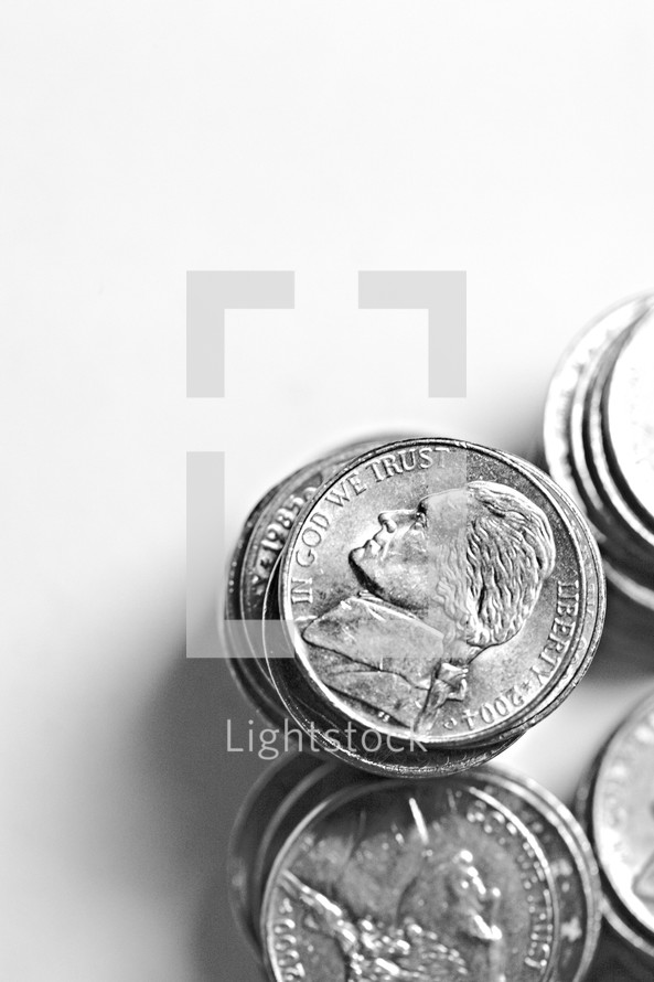 Stacks of nickels isolated on white