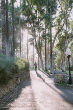 a man jogging on a path in a park 