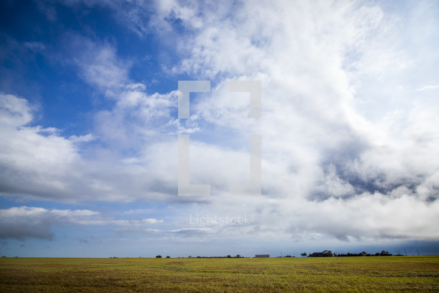clouds and blue sky over a prairie 