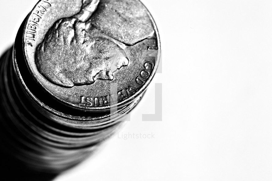 A stack of nickels isolated on white