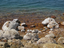 Salt covered rocks on the Dead Sea shore