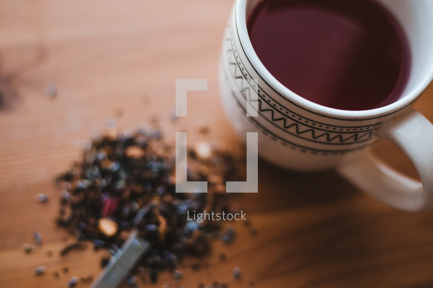 tea and a mug on a wood table 