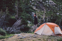 man standing near a tent 