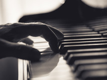 hand on piano keys 