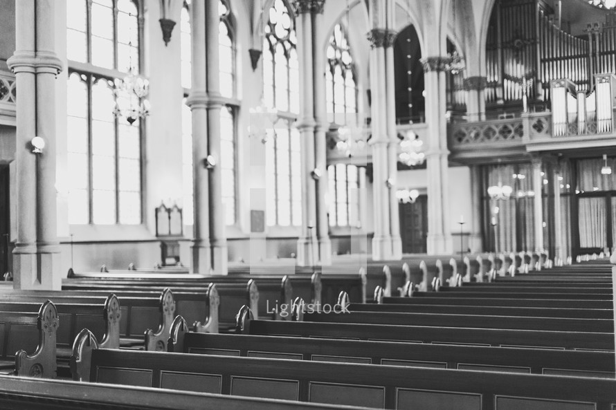 rows of pews in a cathedral 