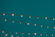 string of lights against an evening sky 