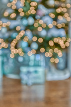 bokeh gifts under a Christmas tree
