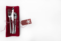 silverware on a red napkin
