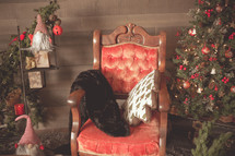red velvet chair and Christmas tree 