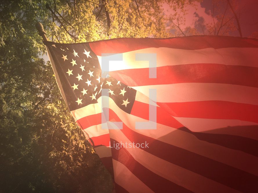 American flag and the glow of sunlight 
