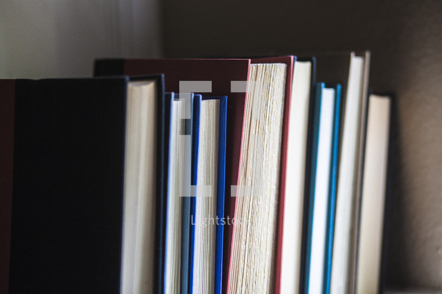 row of books on a bookshelf 