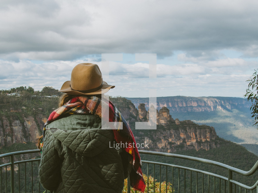 a woman looking over a viewing site in the blue mountains 