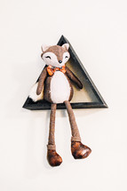 fox stuffed animal on a display shelf 