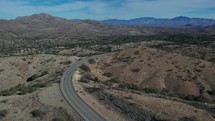 Aerial of a curvy country road in a remote desert landscape
