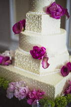 Wedding cake with purple and pink flowers