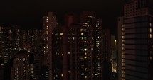 Night illumination flight over hong kong city downtown.