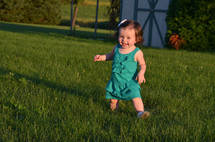 Happy little girl in yard