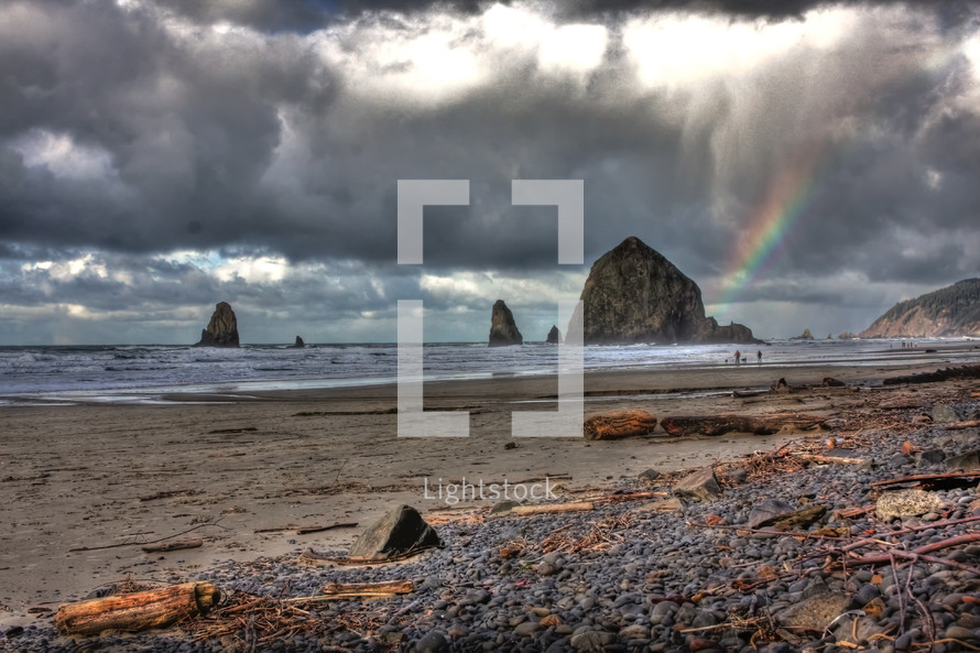 rocks and rainbow on a rocky coast