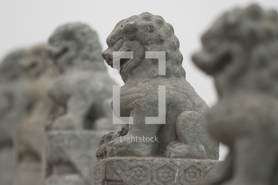 Carved Stone Lions on a bridge, symbol of royalty