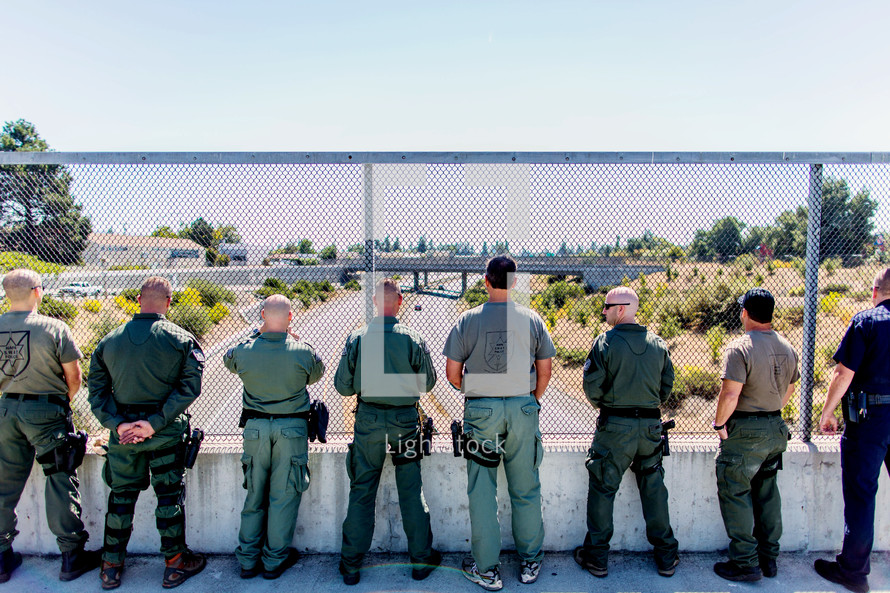 police officers looking over a bridge swat tribute highway patrol