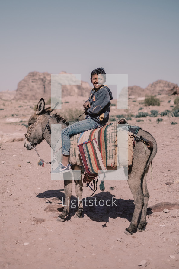 boy on a donkey 