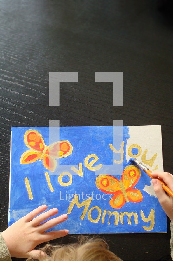 child painting a picture for mommy, 
picture, butterflies, Mother's Day, paint, painting, paintbrush, brush, yellow, orange, red, golden, present, gift, love, Mother's Day, mother's day, mom, mother, mummy, mum, mommy, nice, lovely, fine, pleasant, fair, pretty, color, colour, colorful, multicolored