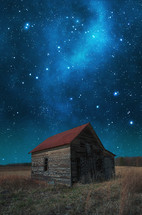 night sky over an old barn