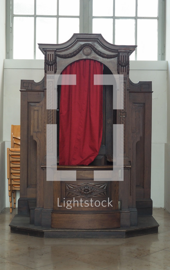 Confessional in a Roman Catholic church in which people can privately confess sins to a priest