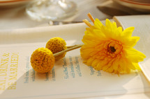 Eat, Drink, and be Married book and yellow flowers 