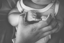 hand on a newborn 