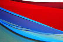red and blue flowing fabric 