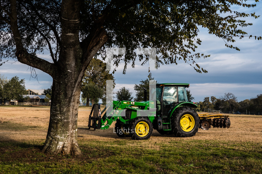 tractor under a tree 