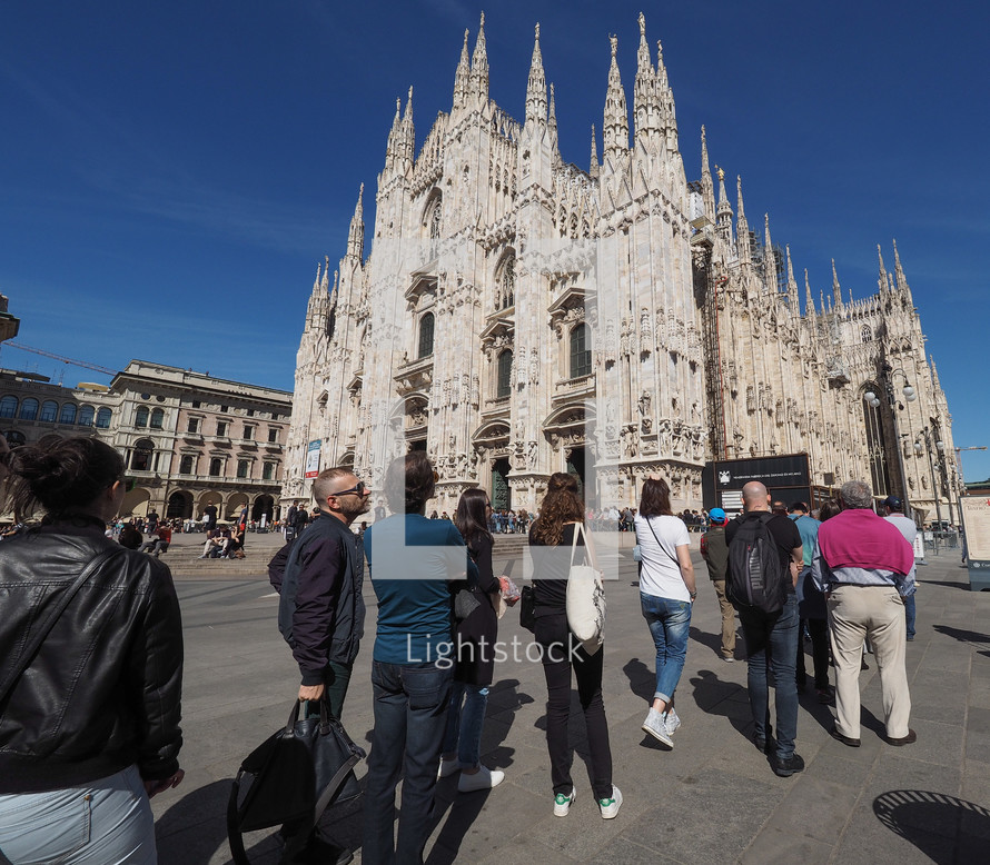 MILAN, ITALY - CIRCA APRIL 2016: Tourists queueing to visit Duomo di Milano (meaning Milan Cathedral) gothic church