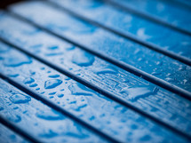water droplets on a deck 